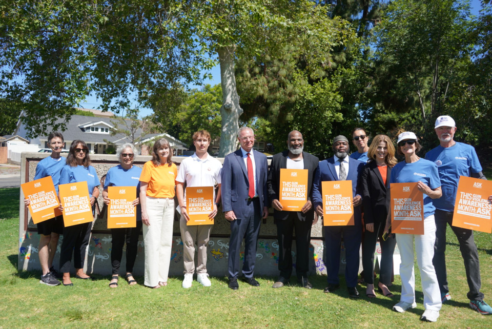 Rep. Peters stands with gun safety advocates at a press conference